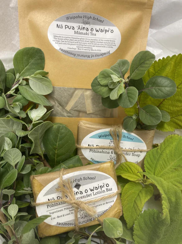 The Hoʻonanea (relaxation) Package contains a bar of pohinahina and lavender soap, a pohinahina and lavender lotion bar, and a packet of 5 individual mamaki tea bags.
